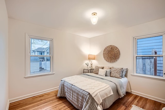 bedroom with hardwood / wood-style floors