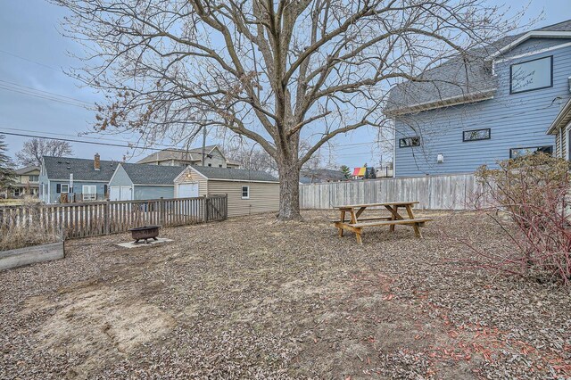 view of yard with a fire pit