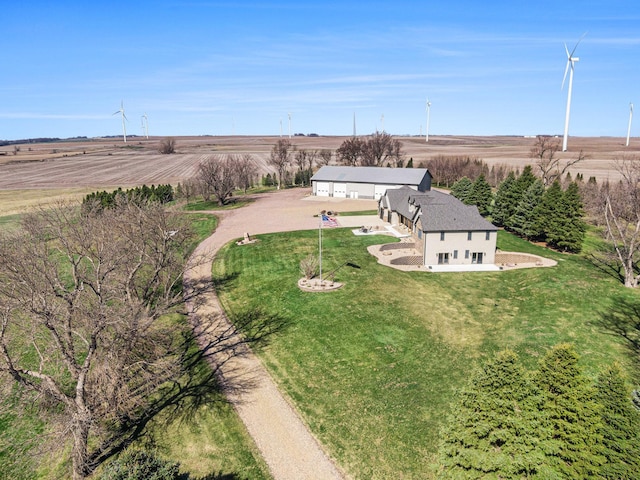 birds eye view of property with a rural view