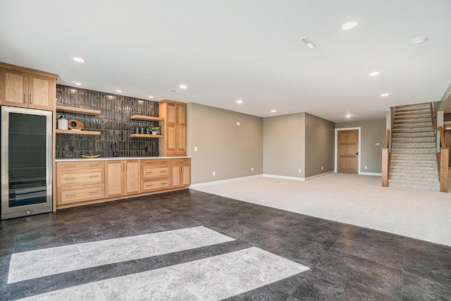 interior space with wine cooler and dark carpet