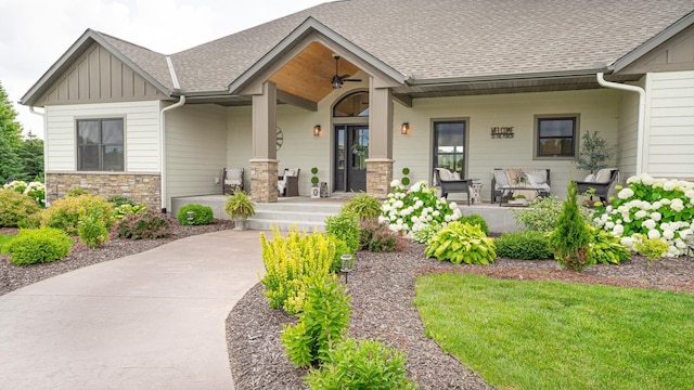 craftsman-style house with ceiling fan and covered porch