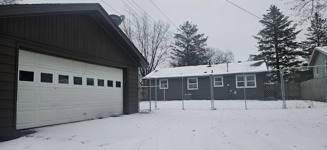 view of snow covered garage