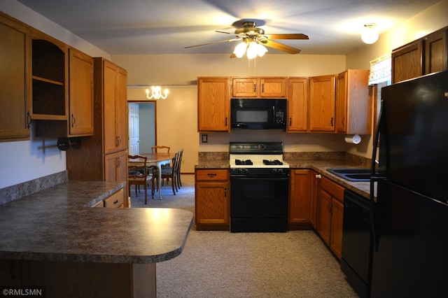 kitchen featuring kitchen peninsula, light carpet, black appliances, and ceiling fan with notable chandelier