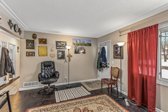 sitting room with a textured ceiling and dark wood-type flooring