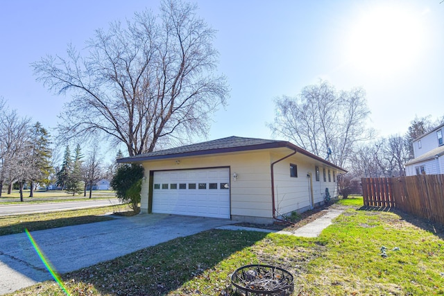 view of side of property featuring an outbuilding and a garage