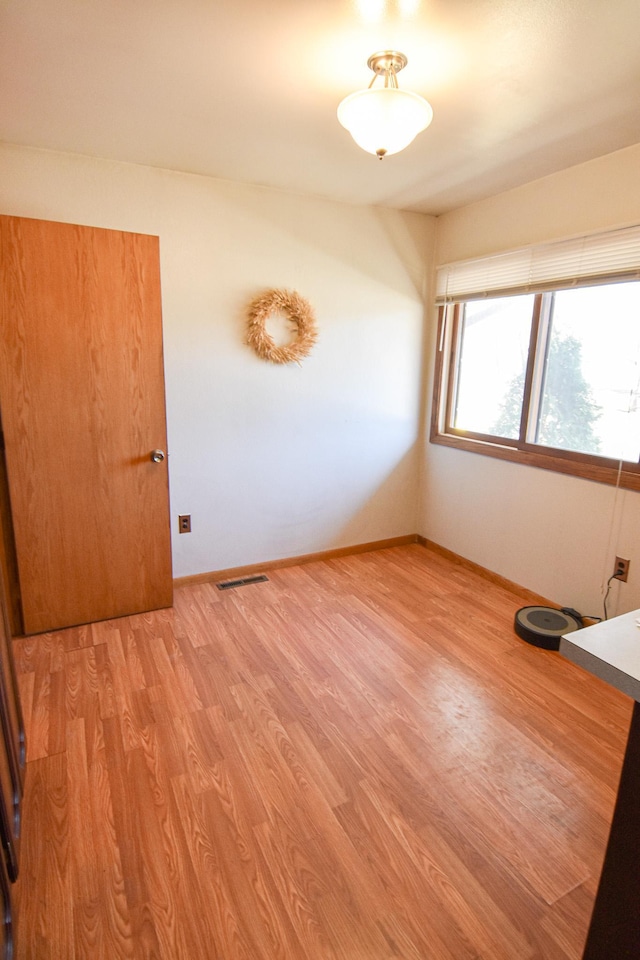 empty room featuring light hardwood / wood-style floors