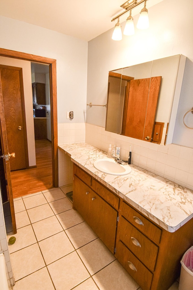 bathroom with tile patterned flooring and vanity