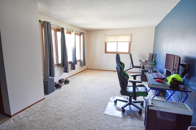 office with carpet flooring and a textured ceiling