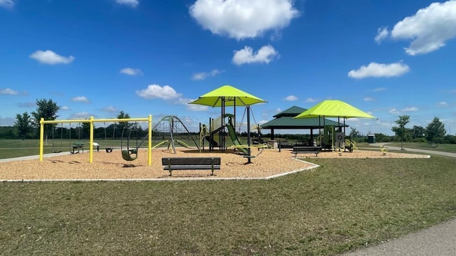 view of playground with a lawn and a gazebo