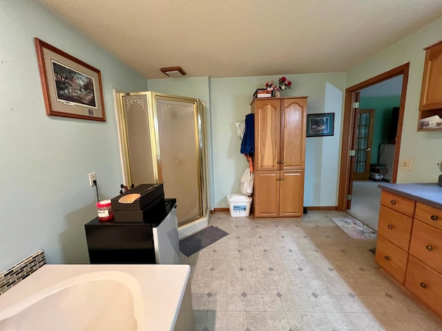 bathroom featuring vanity and walk in shower