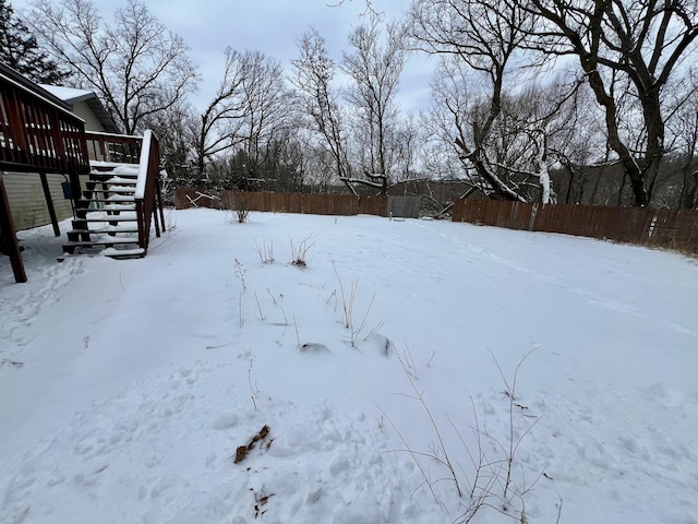 view of yard layered in snow