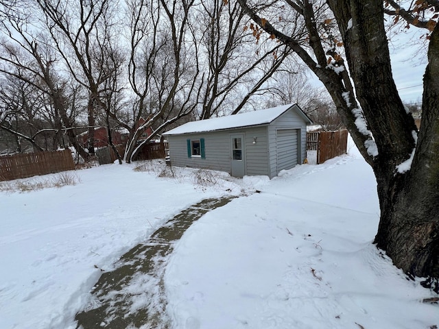 exterior space with an outbuilding and a garage