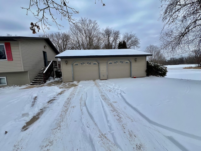 view of snow covered garage