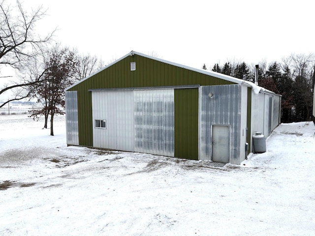 5114 46th St, Merton Twp, MN 55060 - snow covered structure featuring an outbuilding