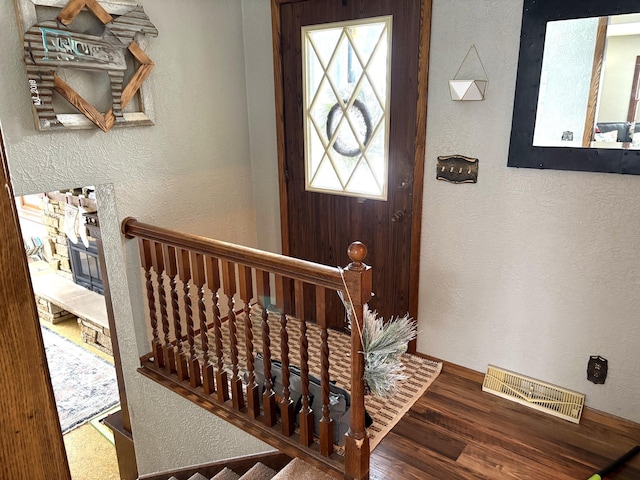 5114 46th St, Merton Twp, MN 55060 - foyer featuring a textured wall, wood finished floors, and baseboards