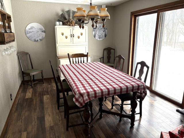 5114 46th St, Merton Twp, MN 55060 - dining area with healthy amount of natural light, a textured wall, and dark wood finished floors