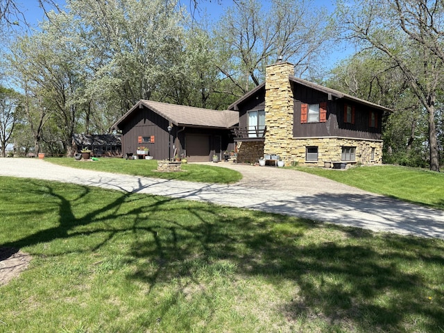 5114 46th St, Merton Twp, MN 55060 - view of property exterior with a chimney, driveway, a yard, and an attached garage
