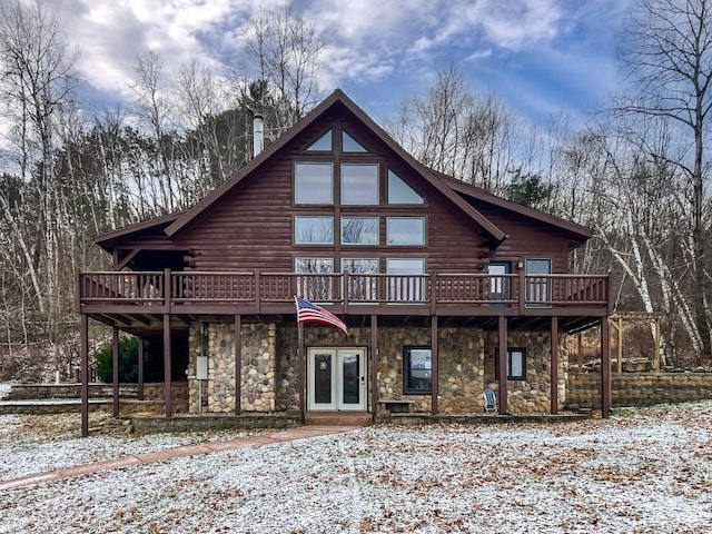 snow covered property featuring a deck