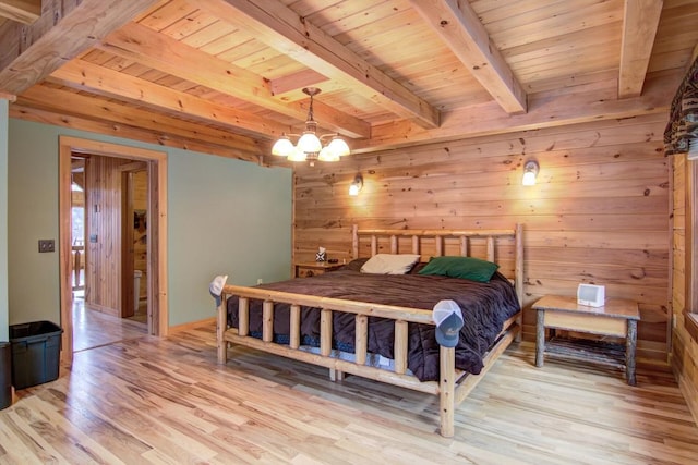 bedroom with wooden ceiling, wooden walls, beamed ceiling, a notable chandelier, and light hardwood / wood-style floors