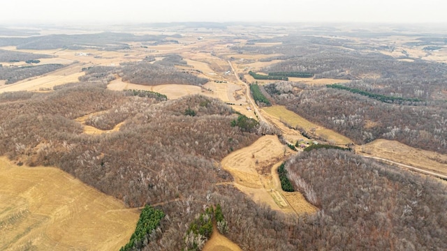 birds eye view of property with a rural view