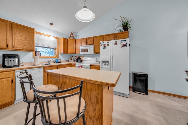 kitchen featuring white appliances, high vaulted ceiling, sink, hanging light fixtures, and a kitchen island