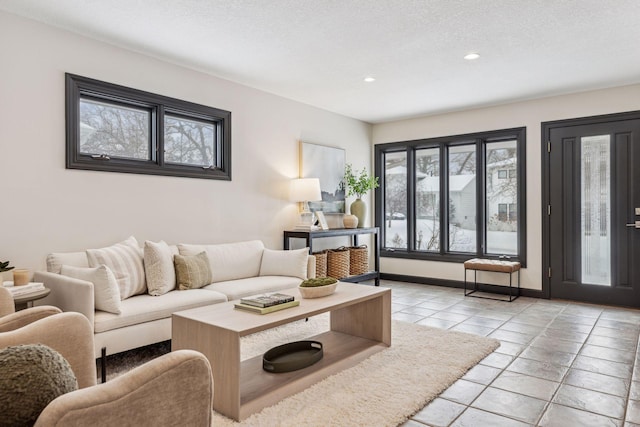 tiled living room with a textured ceiling