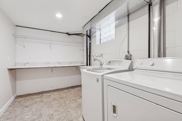 laundry area with washer and dryer and sink