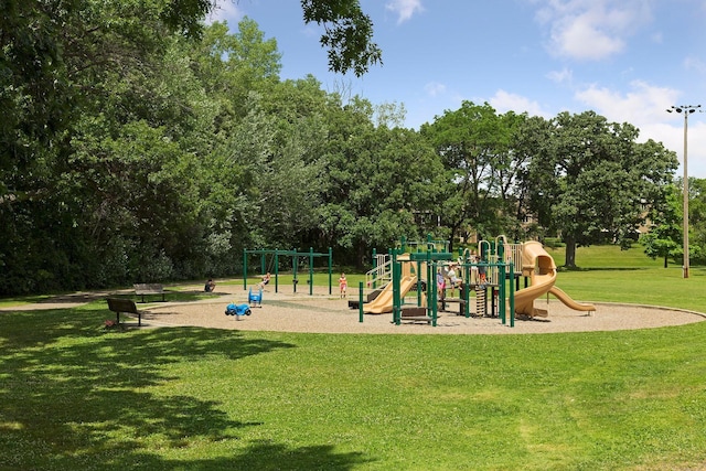 view of jungle gym featuring a lawn