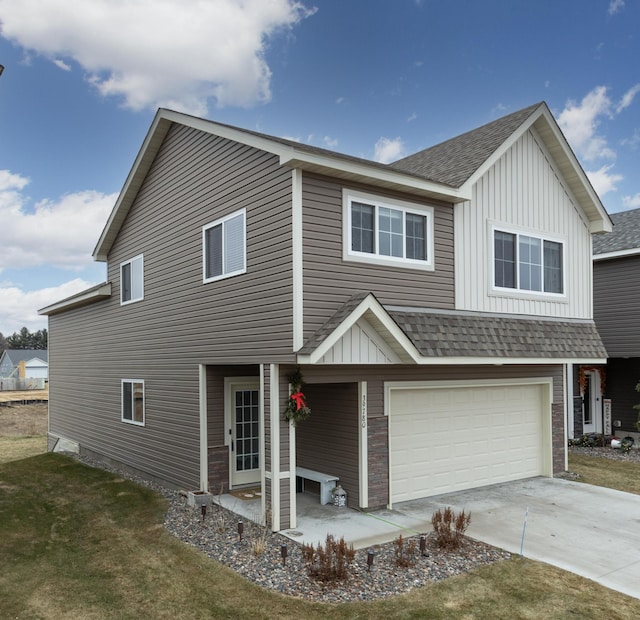 view of front facade with a garage and a front yard