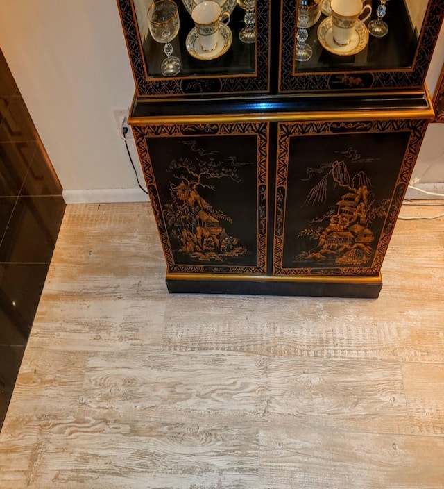 interior details featuring hardwood / wood-style flooring