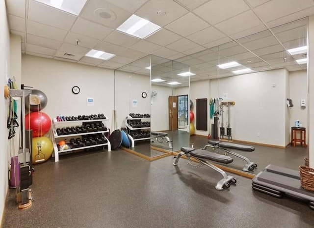 exercise room featuring a paneled ceiling