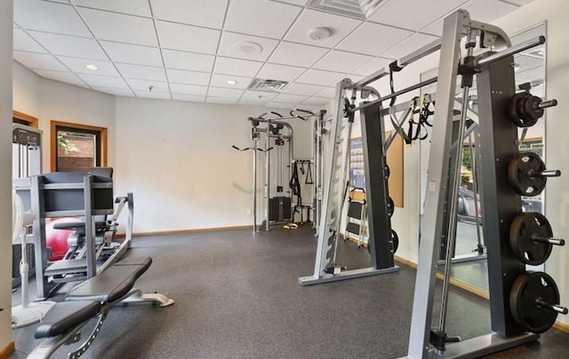 workout area featuring a drop ceiling