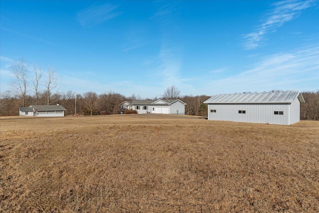 view of yard with an outdoor structure and a pole building