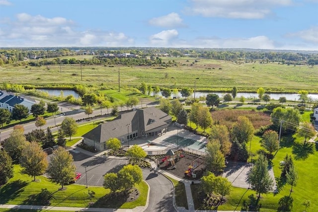 birds eye view of property featuring a water view and a rural view