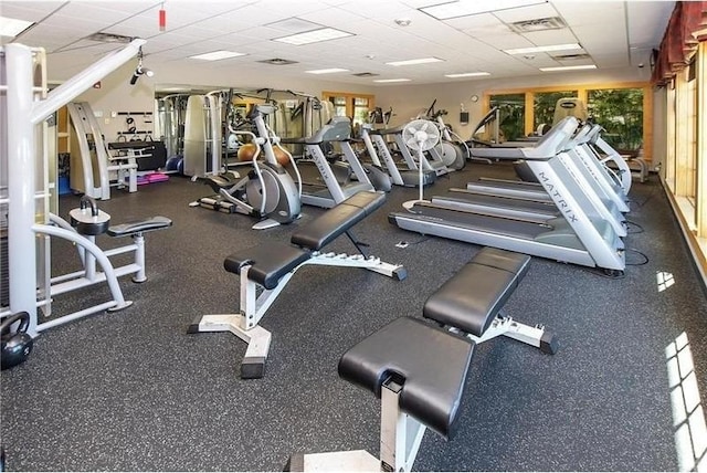 exercise room with a drop ceiling