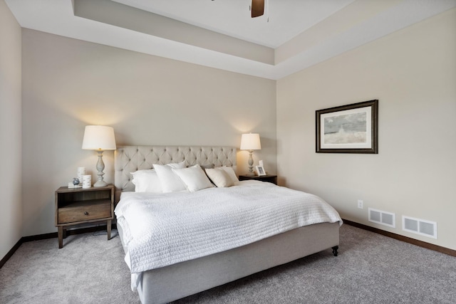 bedroom with carpet flooring, ceiling fan, visible vents, and baseboards