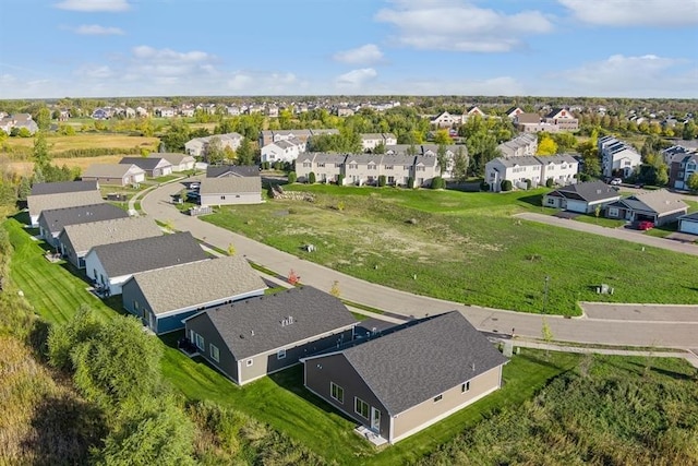 birds eye view of property with a residential view