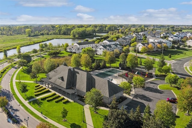 birds eye view of property with a residential view and a water view