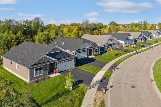 birds eye view of property with a residential view