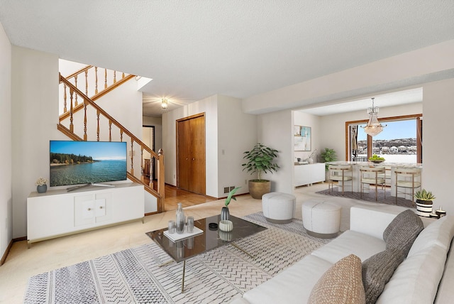 living room with a textured ceiling