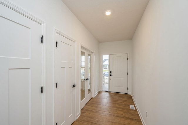 doorway to outside with hardwood / wood-style floors