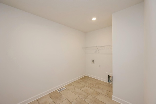 washroom featuring washer hookup and light tile patterned floors