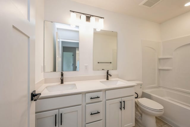 full bathroom featuring tile patterned flooring, vanity, tub / shower combination, and toilet