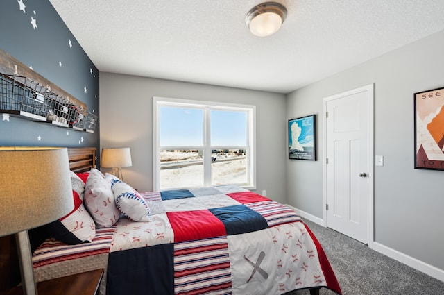 bedroom with carpet and a textured ceiling