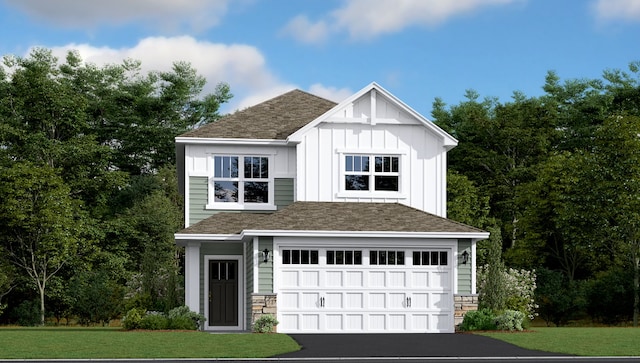 view of front of property featuring a garage and a front yard