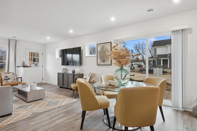 dining area with hardwood / wood-style floors