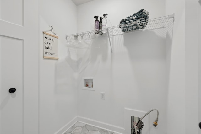 laundry room with hookup for a washing machine and light tile patterned flooring