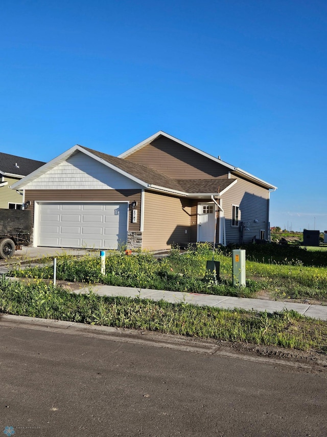 single story home with a garage