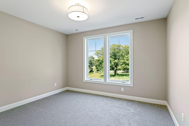 empty room featuring carpet flooring