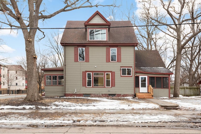 view of front of home with a shingled roof